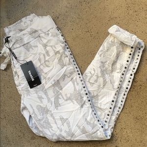 White and gray camouflage joggers.